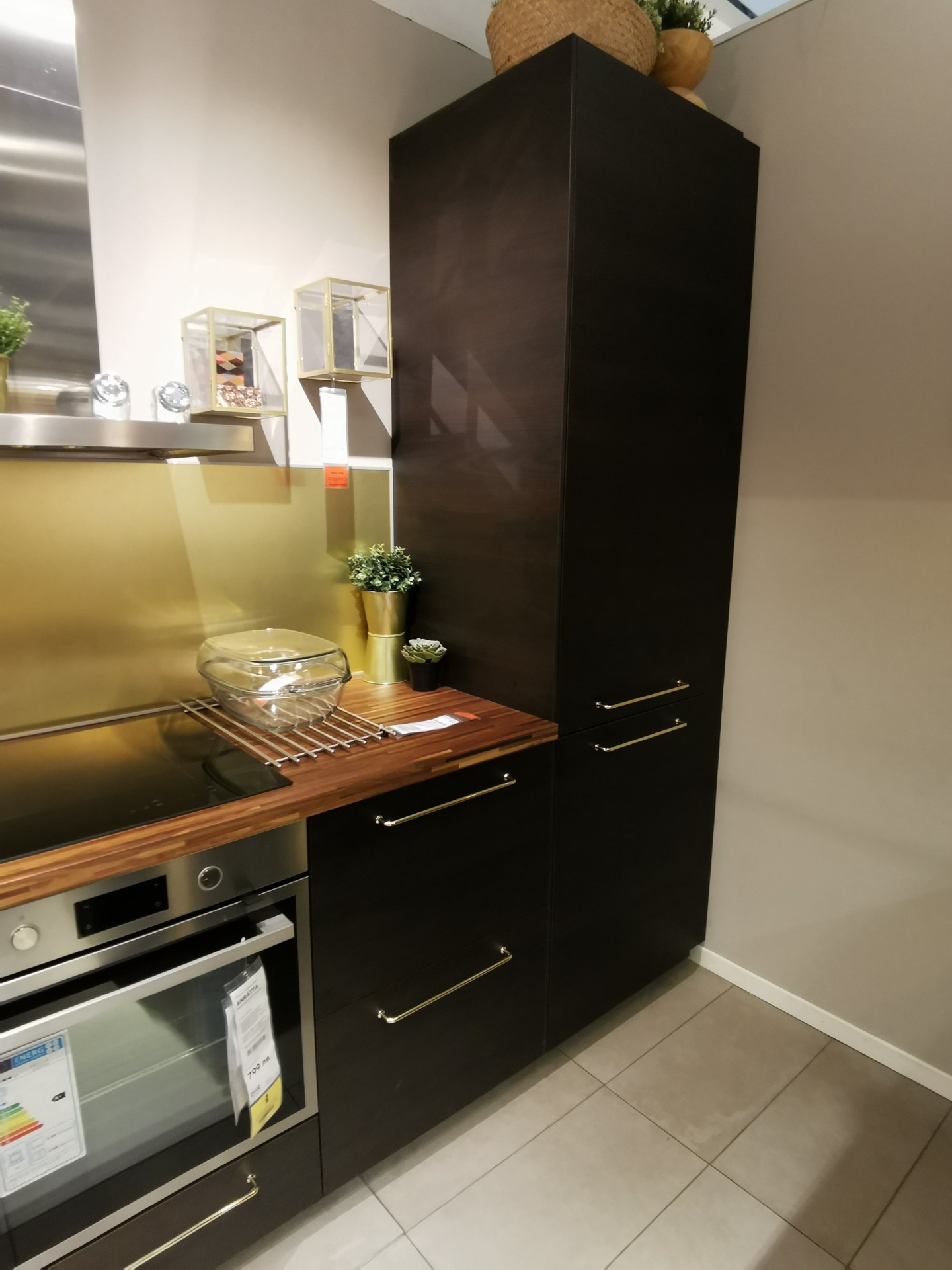 IKEA Askersund dark brown kitchen with Jutis smoked glass door